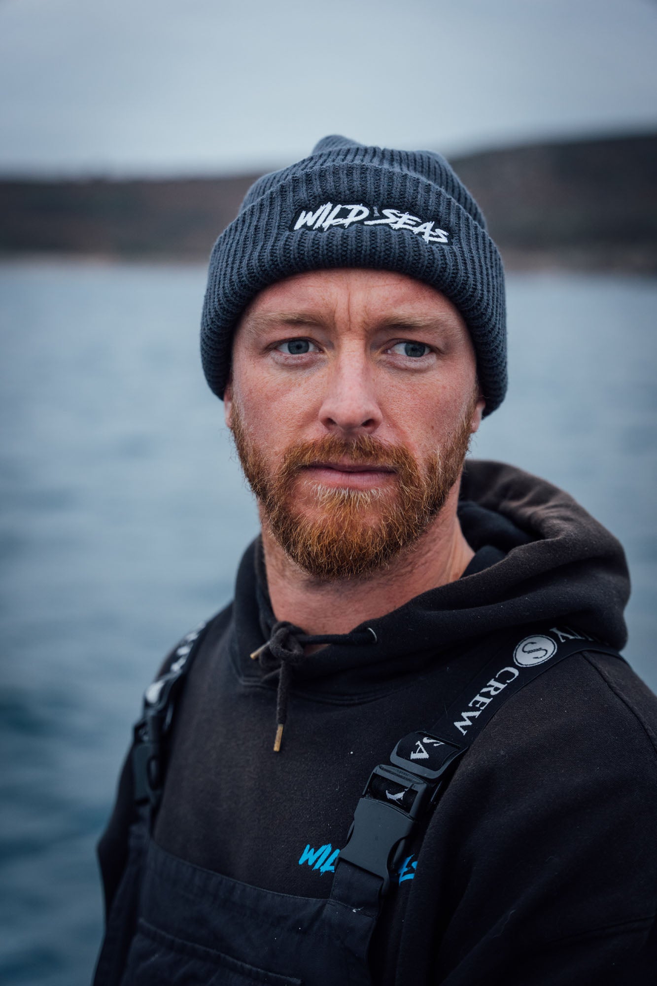 A fisherman wearing the Wild Seas Skipper Beanie hat