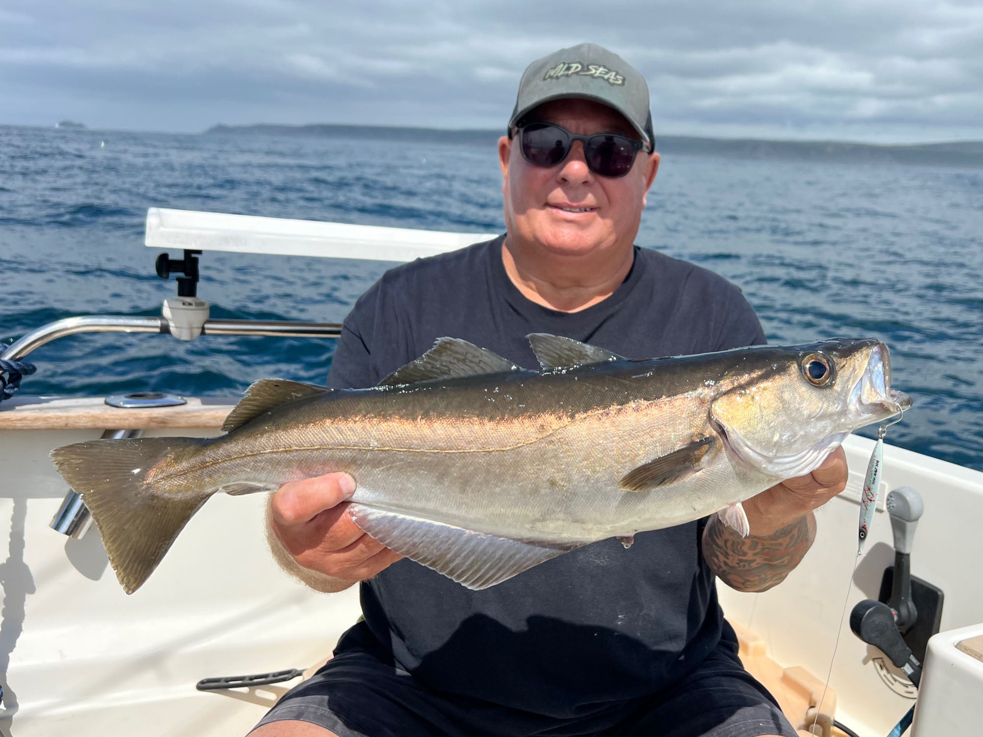 Phil with a Pollack caught using the Fish Nugz Slayer Cast jig from a boat