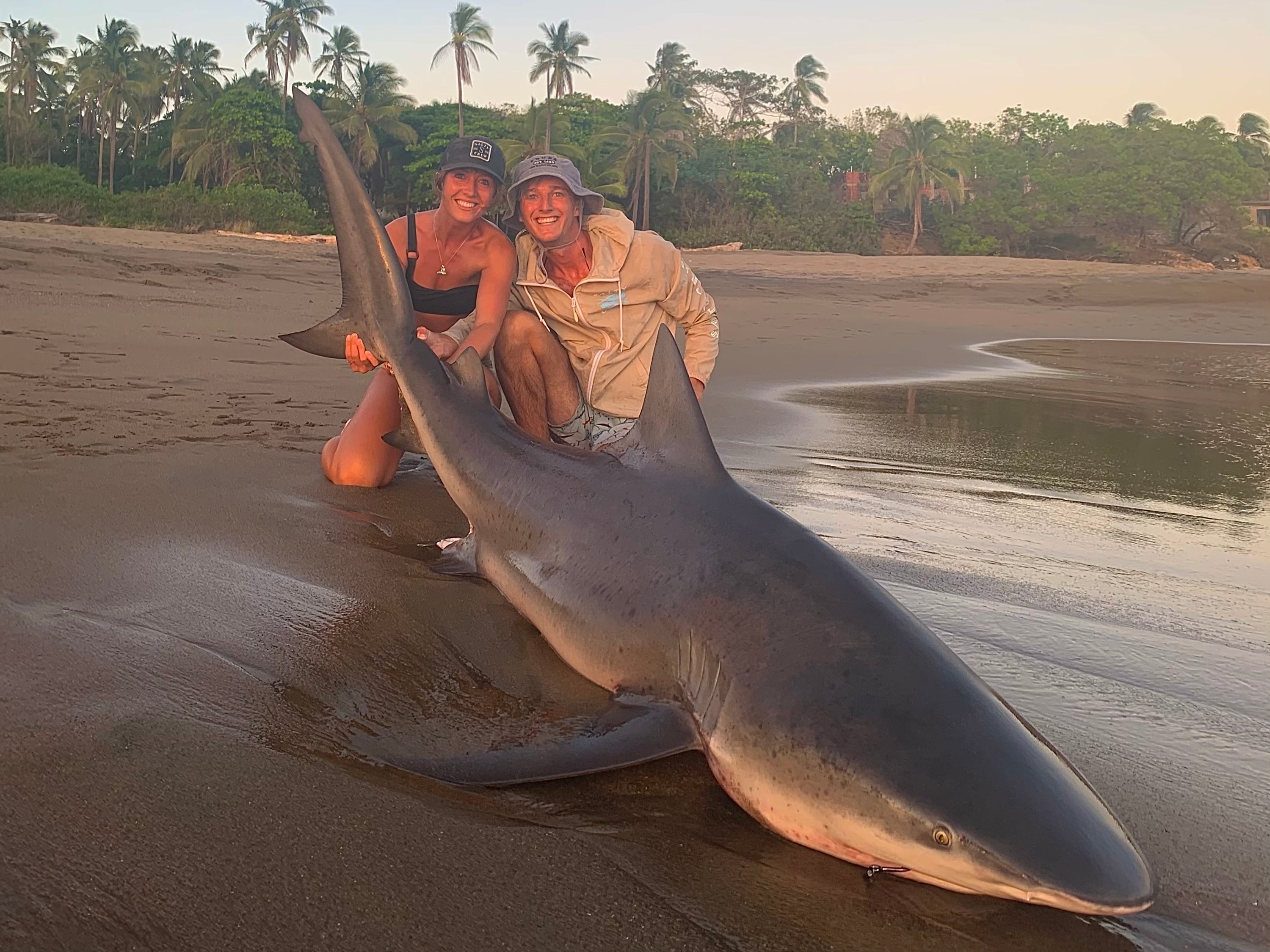 Kieren with a large shark caught from a beach in Panama