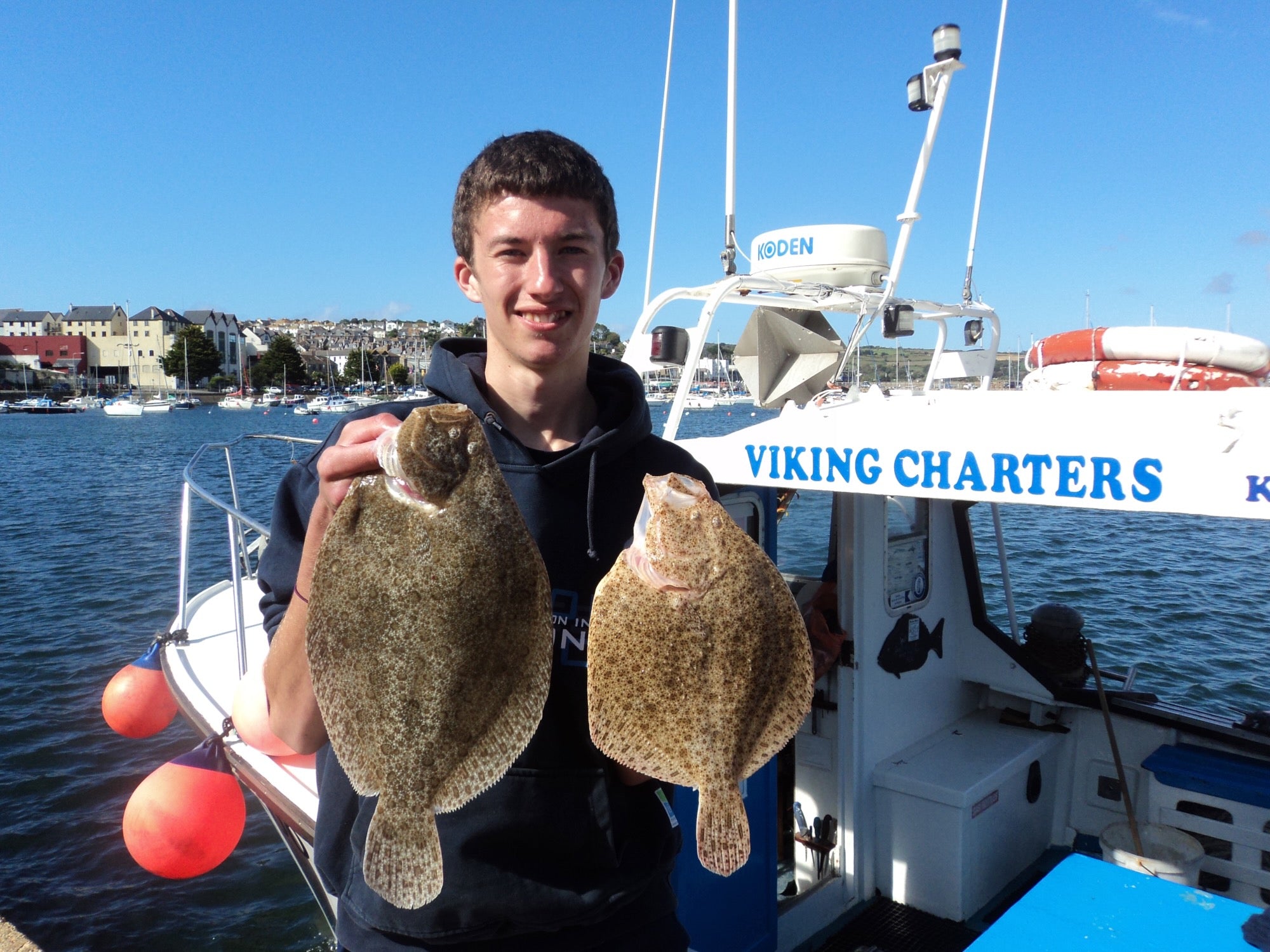 Liam with a Turbot and Brill flatfish caught from Penzance Boat Fishing