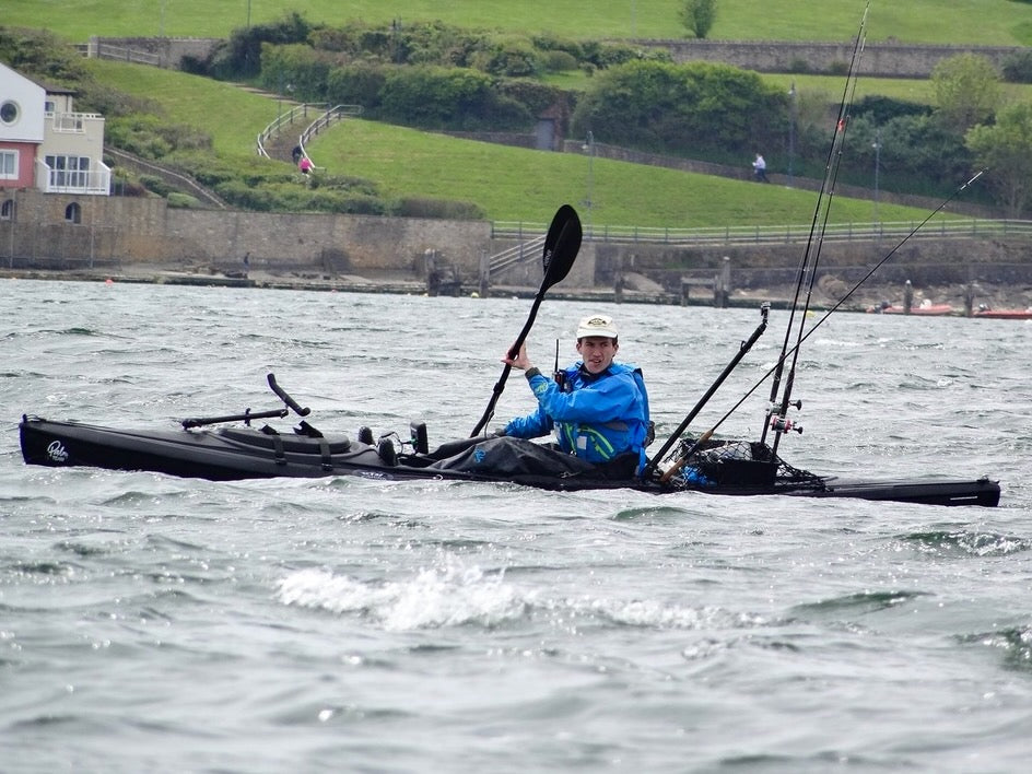 Wild Seas Liam paddling his fishing kayak