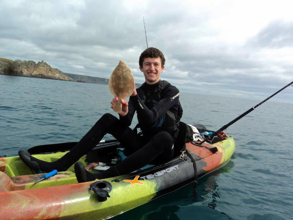 Liam with a Plaice caught on his first kayak