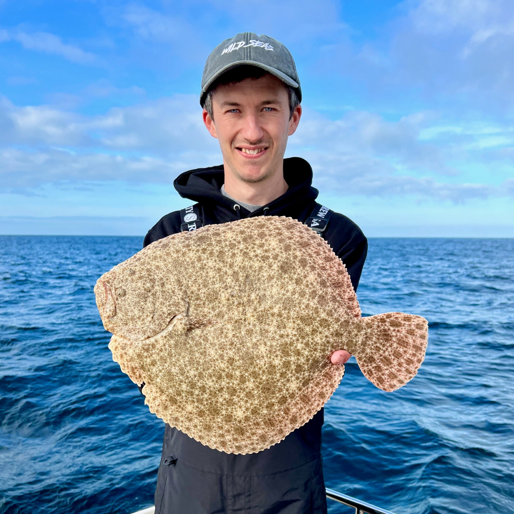Liam with a Turbot caught boat fishing in Cornwall