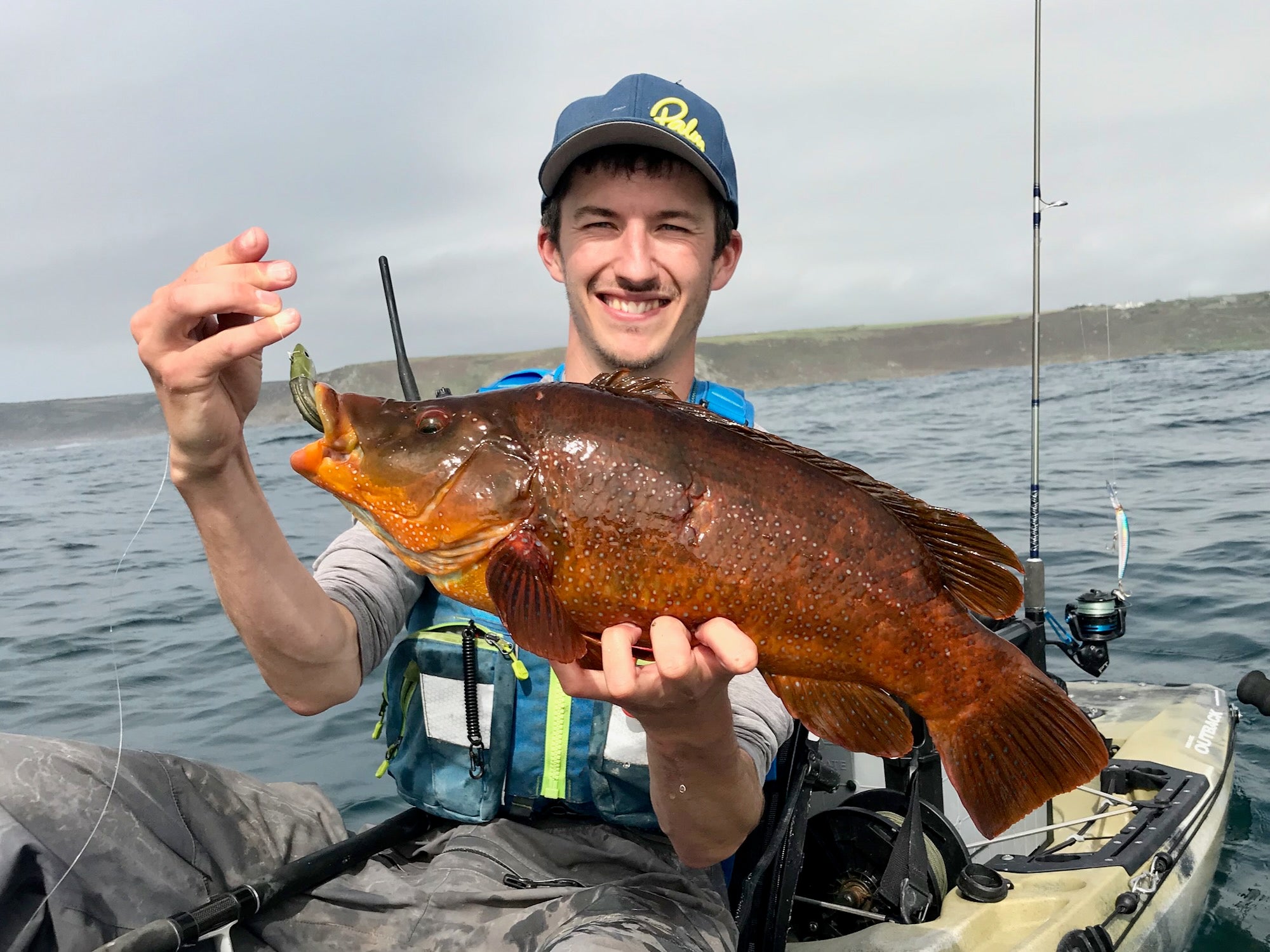 Liam with a specimen Ballan Wrasse caught on a lure from his kayak