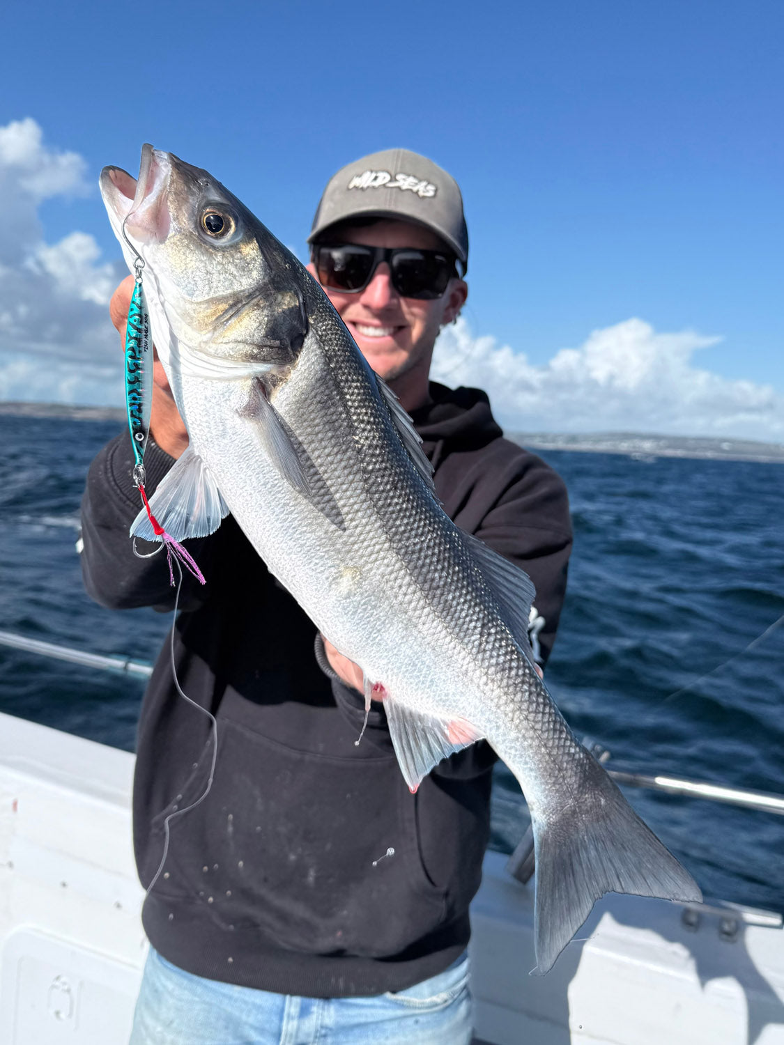 Fish Nugz Slayer Cast Jig in Filthy Mack catches a Bass from the boat