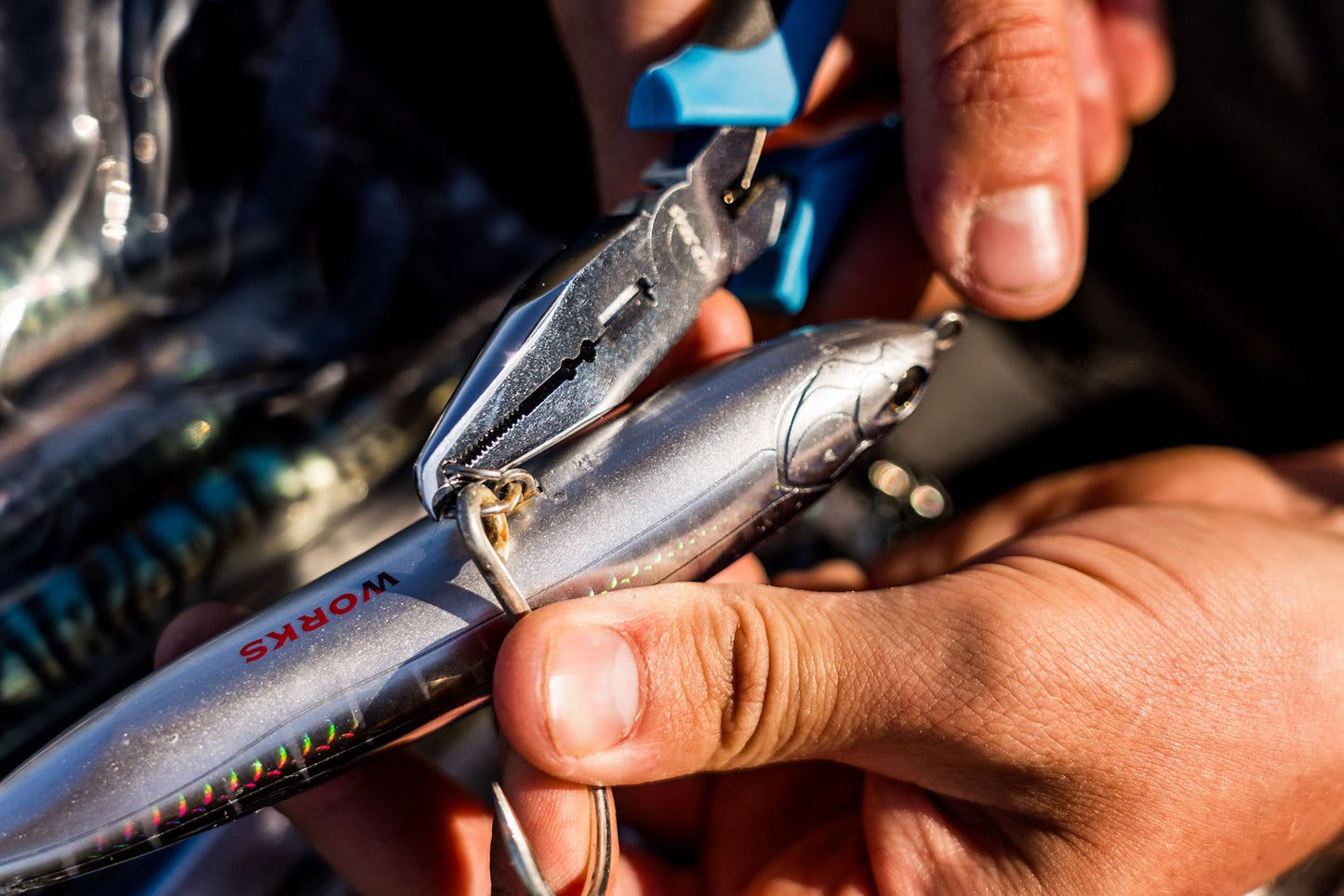 Opening a powerful split ring to add a hook onto a stick bait with the Wild Seas Big Game Pliers