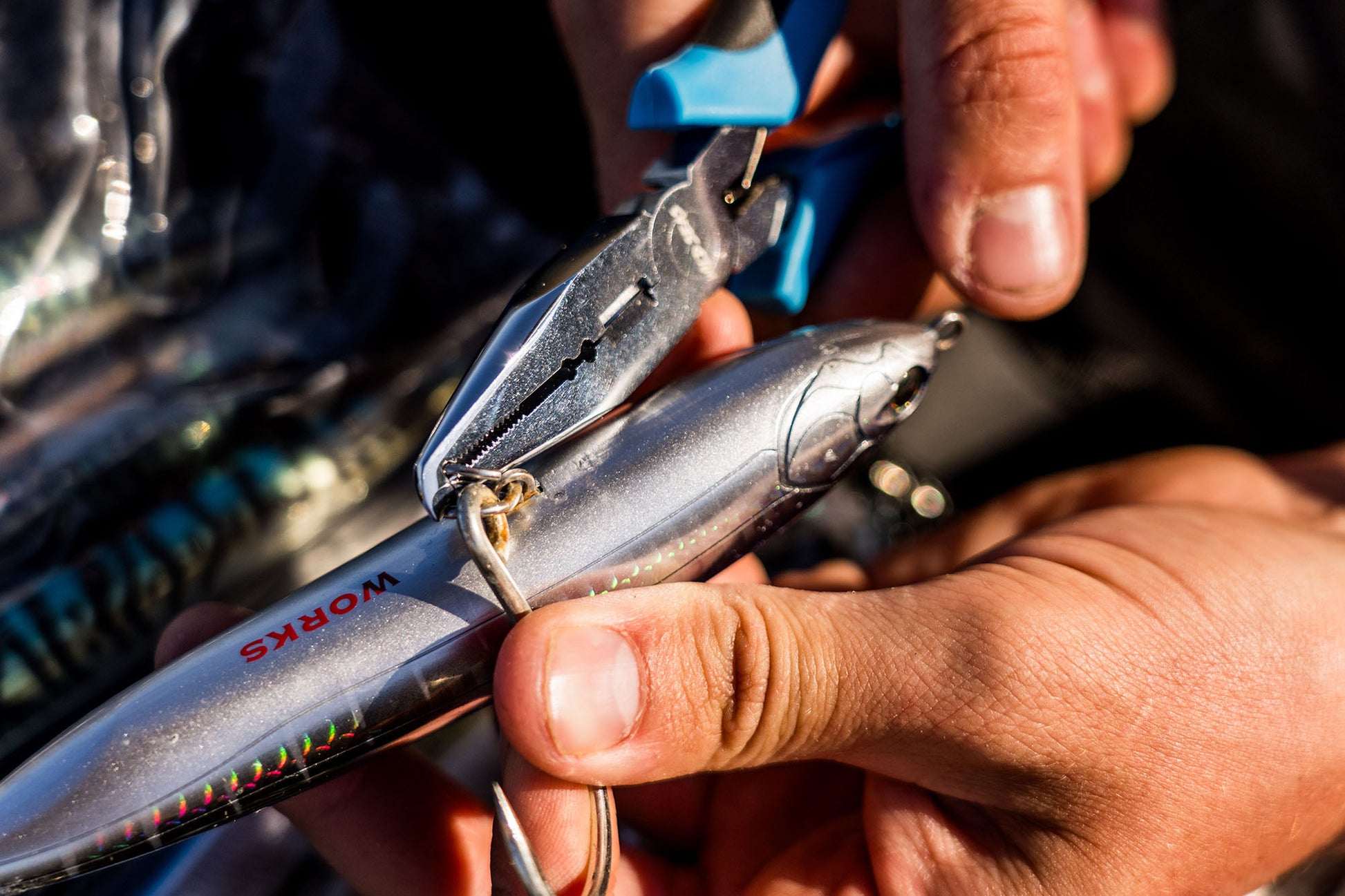 Opening a powerful split ring to add a hook onto a stick bait with the Wild Seas Big Game Pliers