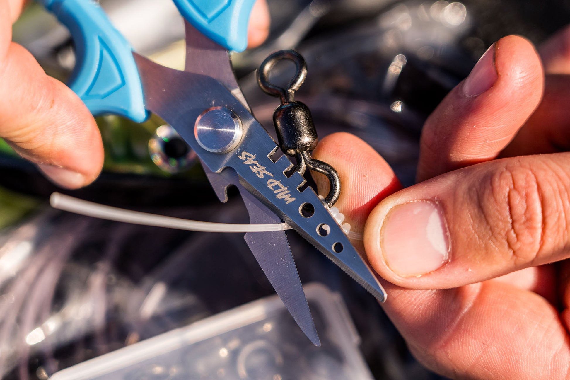 Wild Seas Braid Scissors cutting through thick mono fishing line