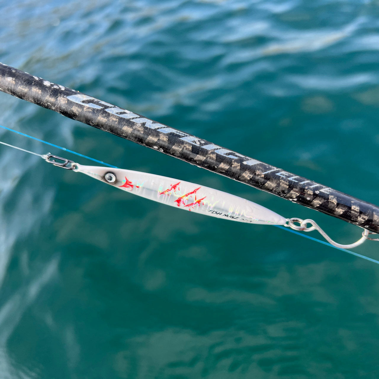 A casting jig attached to fishing line using the Wild Seas Quick-Change Mini Lure Clip