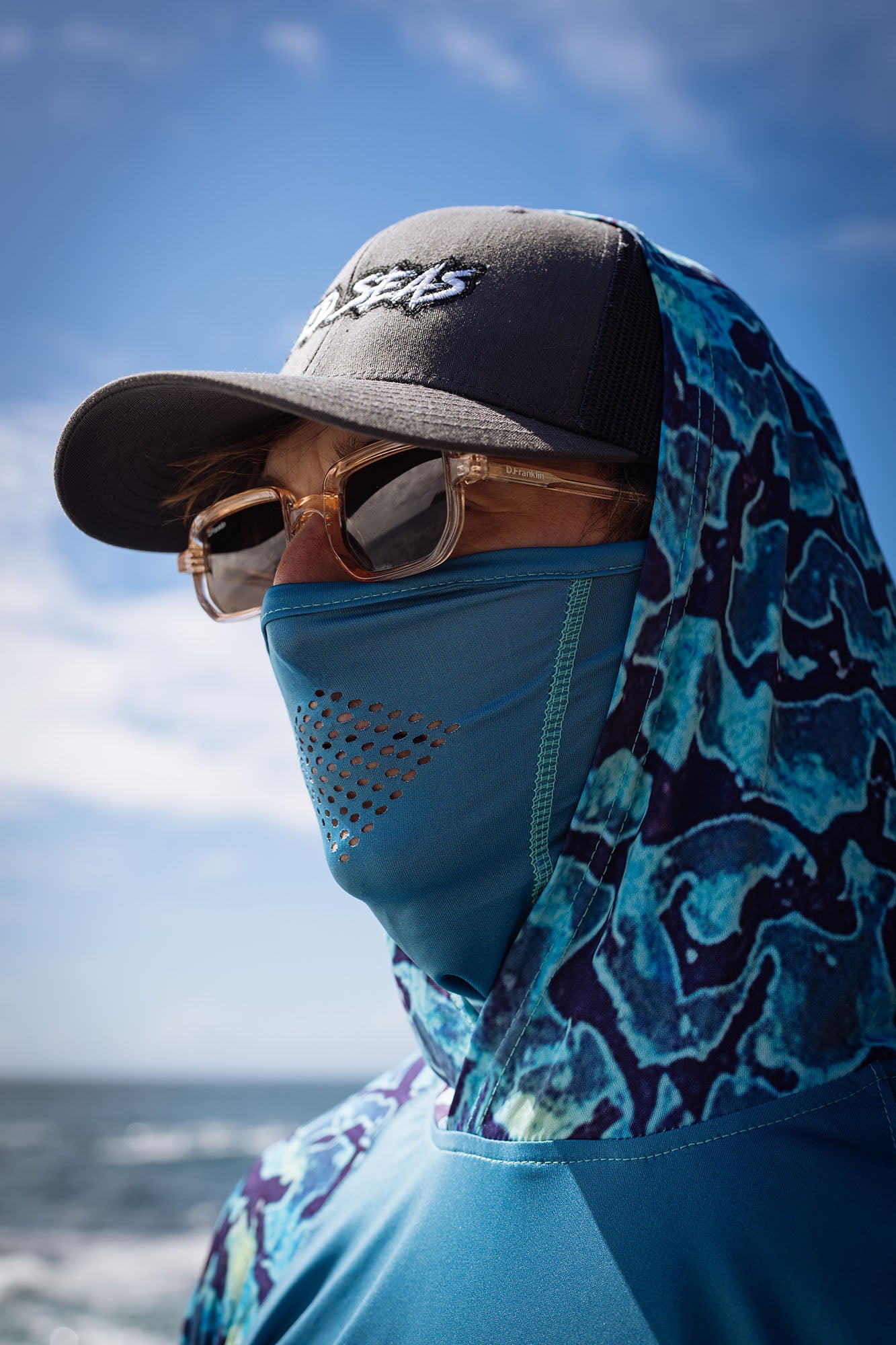 Wild Seas UV Face Buff in Swell Blue worn with the Performance UV Hoodie