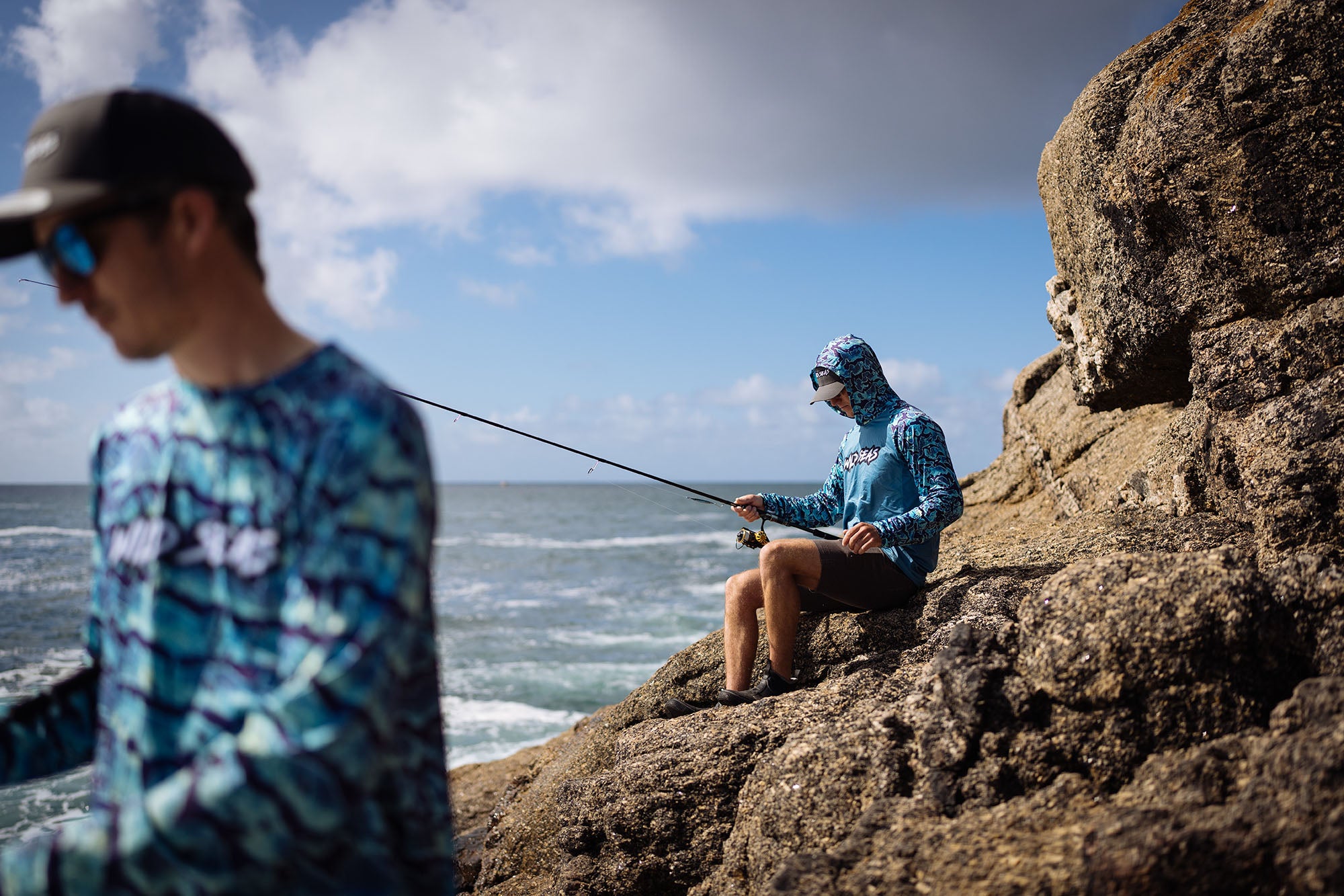 Wearing the Wild Seas Performance UV Hoodie whilst fishing on the rocks