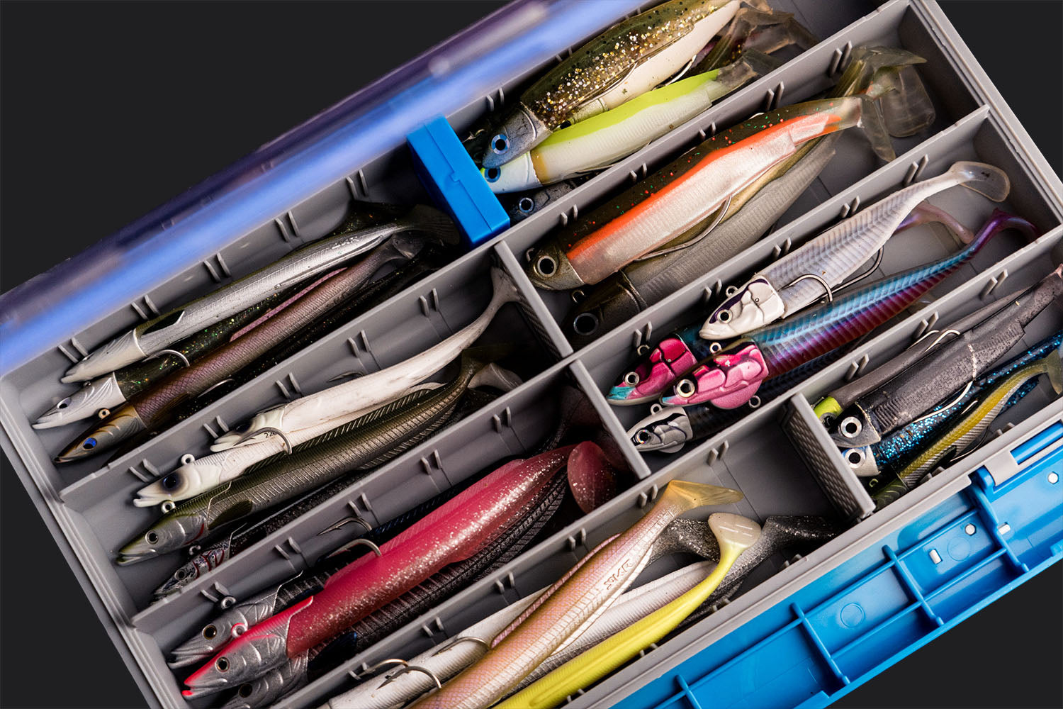Soft plastic fishing lures stored in the Wild Seas Waterproof Tackle Box
